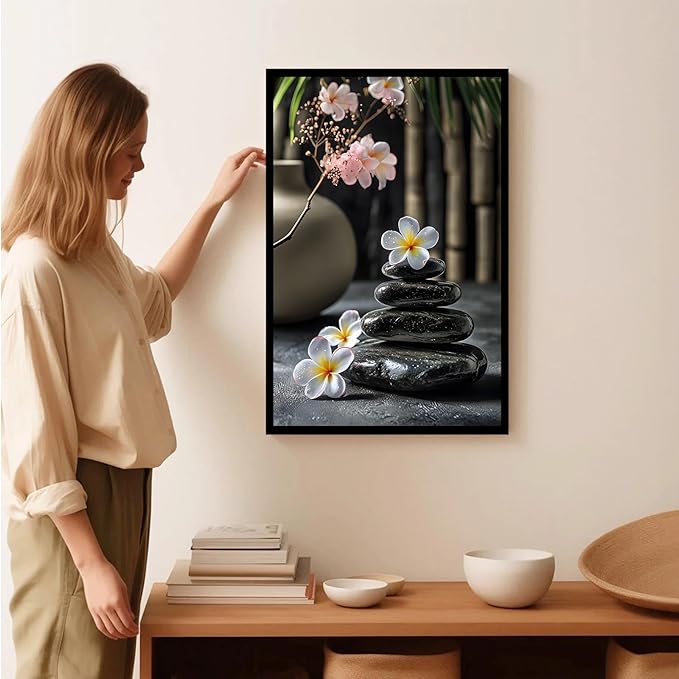 A harmonious black stone stack paired with white and pink flowers bamboo and ceramic vases creates a tranquil Zen decor for minimalist homes and mindful spaces 8x12in Metal blackFramed
