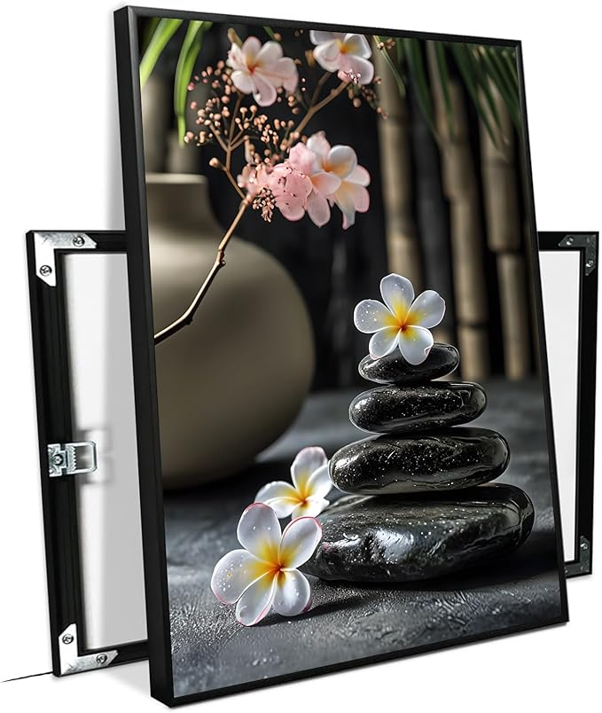 A harmonious black stone stack paired with white and pink flowers bamboo and ceramic vases creates a tranquil Zen decor for minimalist homes and mindful spaces 24x36in Metal blackFramed