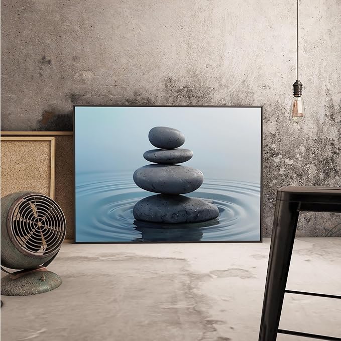 Zen wall art Harmonious grey stones stacked on a calm surface of water Serene Zen decor suitable for tranquil homes and spaces of meditation 12x18in Metal blackFramed